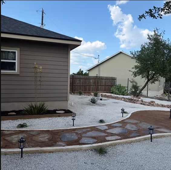 Xeriscape yard with flagstone walkway and low-voltage path lighting